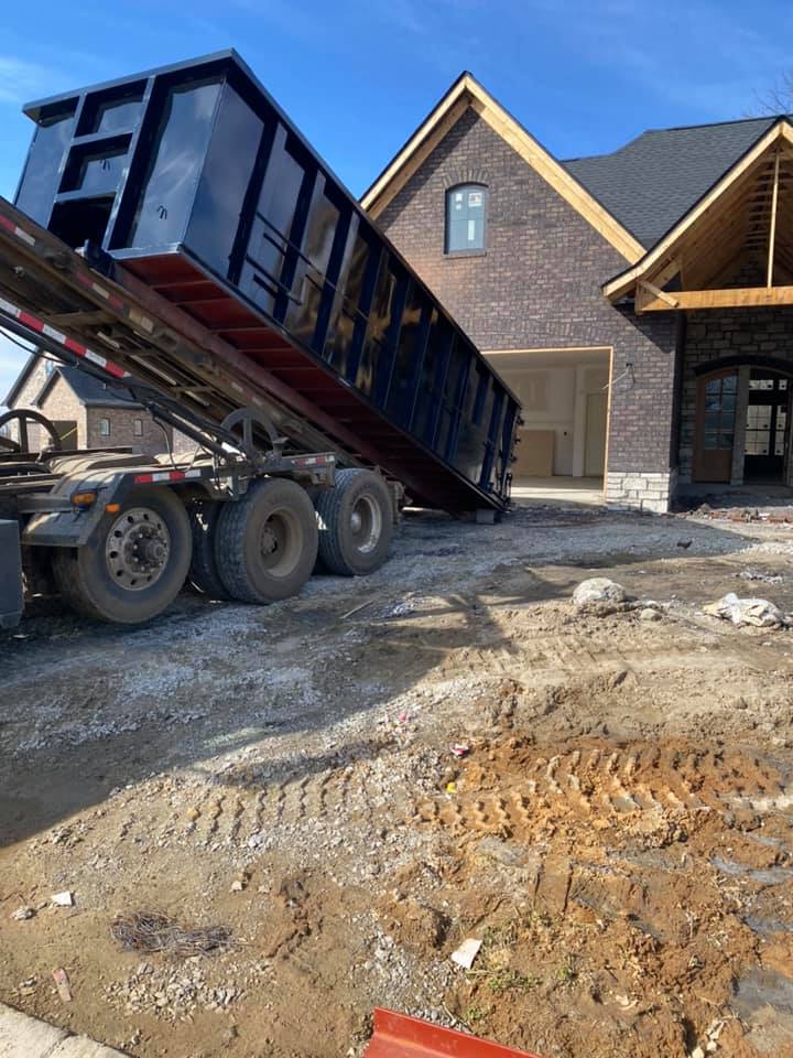 black box dumpster at new home construction site