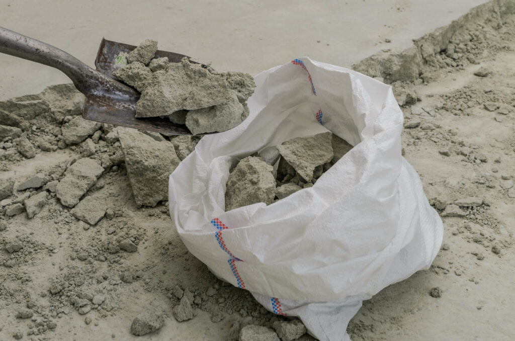 demolition clean up - concrete being moved with a shovel